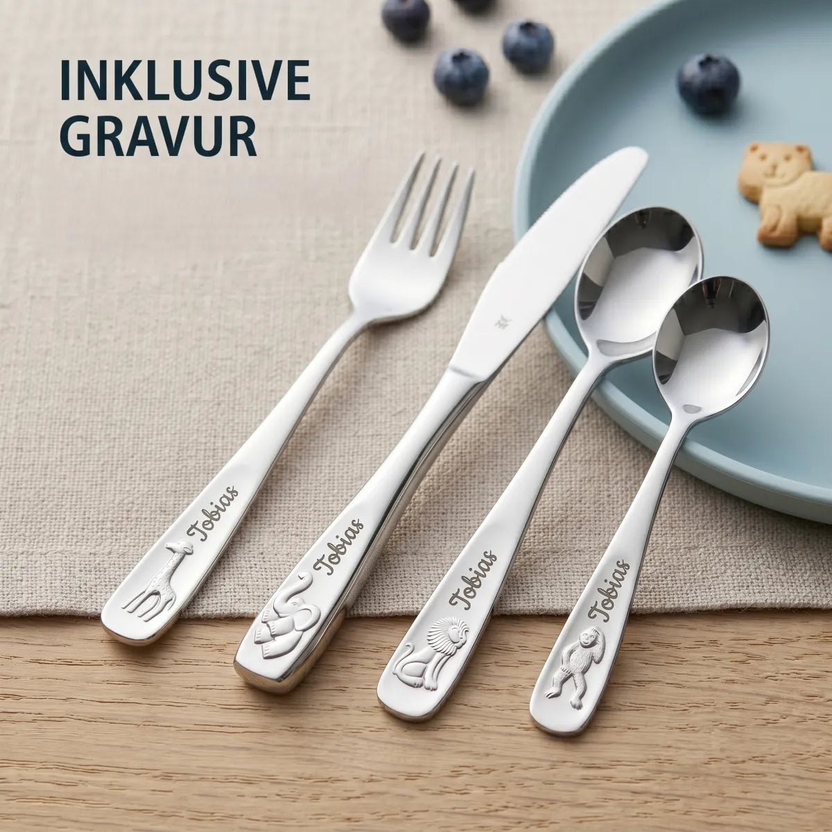 WMF Kinderbesteck Set 4-teilig aus glänzendem Cromargan Edelstahl mit Tiermotiven, personalisiert mit einer Gravur.