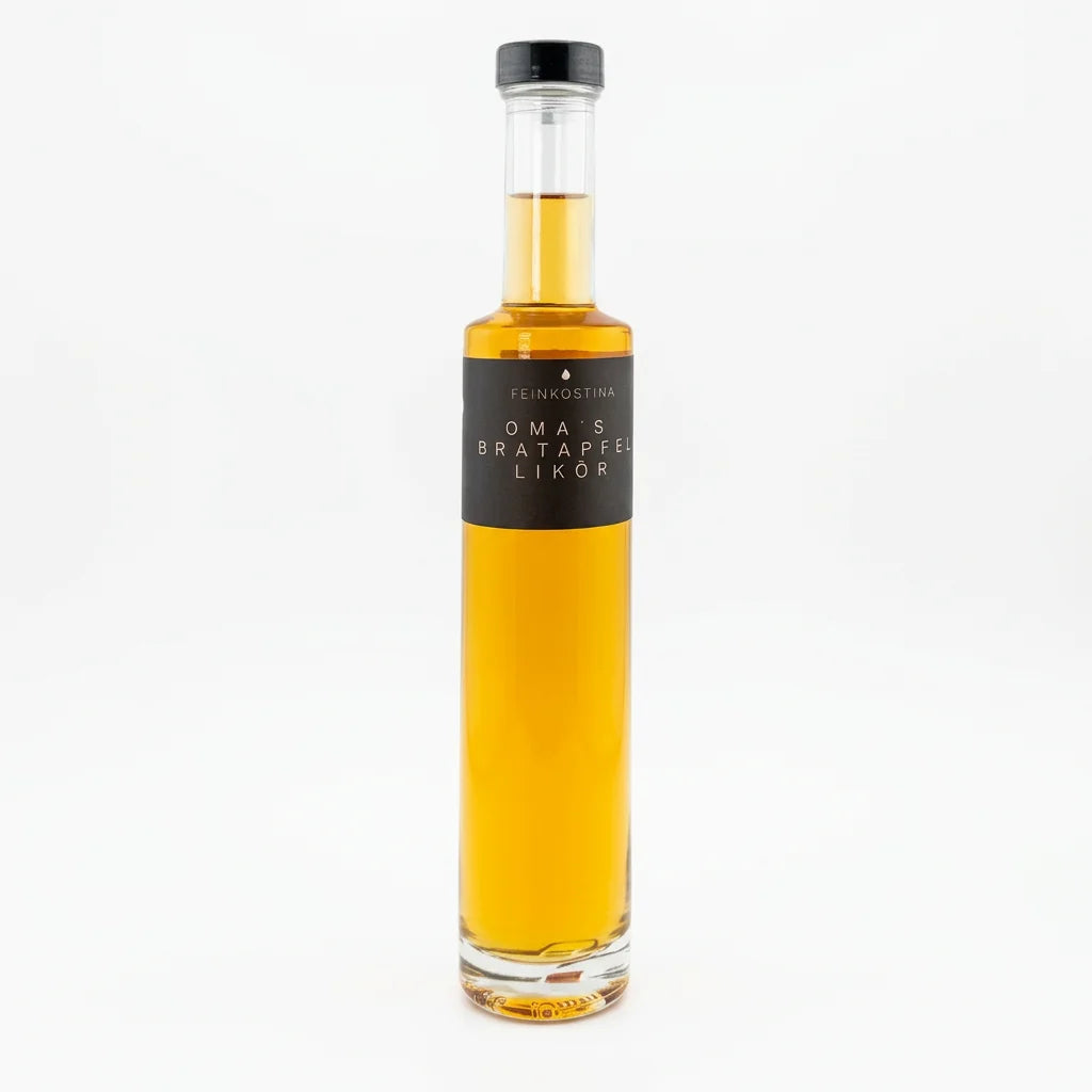 Flasche Bratapfel Likör von Feinkostina, 200 ml, mit bernsteinfarbener Flüssigkeit und winterlichem Etikett.