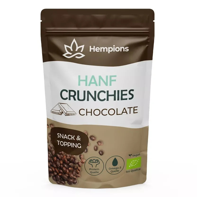 Nahaufnahme knuspriger, schokoladenüberzogener Hanf Crunchies in einer Schale. Mit dunkler Schokolade und heller Hanfsamenstruktur. — 50g