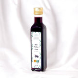 BIO Holleressig – Würziger Essig aus Apfelessig und schwarzen Holunderbeeren mit Zimt, Piment und Nelken. 100% biologisch und nachhaltig hergestellt in Österreich, 250 ml Flasche.