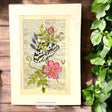 Original-Illustration von Book Fairy Art auf alter Buchseite mit Passepartout und optionalem Nussrahmen – nachhaltige Kunst aus Österreich