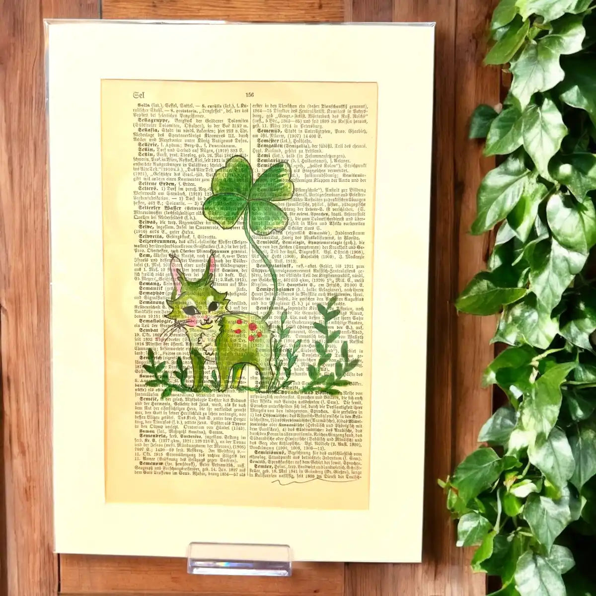Original-Illustration von Book Fairy Art auf alter Buchseite mit Passepartout und optionalem Nussrahmen – nachhaltige Kunst aus Österreich