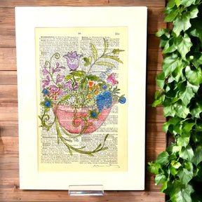 Original-Illustration von Book Fairy Art auf alter Buchseite mit Passepartout und optionalem Nussrahmen – nachhaltige Kunst aus Österreich