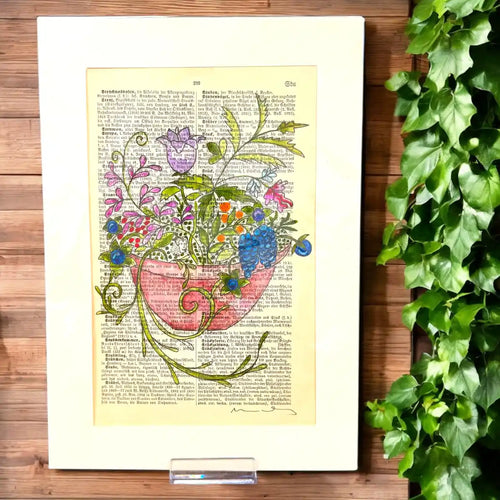 Original-Illustration von Book Fairy Art auf alter Buchseite mit Passepartout und optionalem Nussrahmen – nachhaltige Kunst aus Österreich