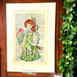 Original-Illustration von Book Fairy Art auf alter Buchseite mit Passepartout und optionalem Nussrahmen – nachhaltige Kunst aus Österreich