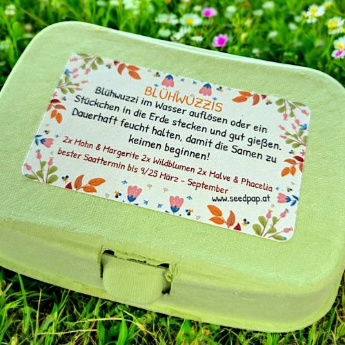 Blühwuzzis von Seedpap, nachhaltige Saatkugeln in pastellfarbener Eierschachtel, mit Wildblumen & Sonnenblumen, ideal für Ostern, Garten & Geschenkideen.

