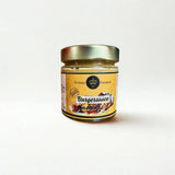 Glasflasche mit cremiger, orangeroter Burgersauce von Kronenfeinkost.