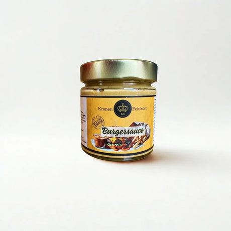 Glasflasche mit cremiger, orangeroter Burgersauce von Kronenfeinkost.