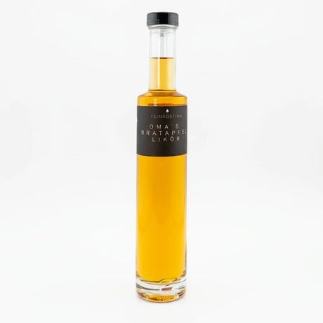 Flasche Bratapfel Likör von Feinkostina, 200 ml, mit bernsteinfarbener Flüssigkeit und winterlichem Etikett.