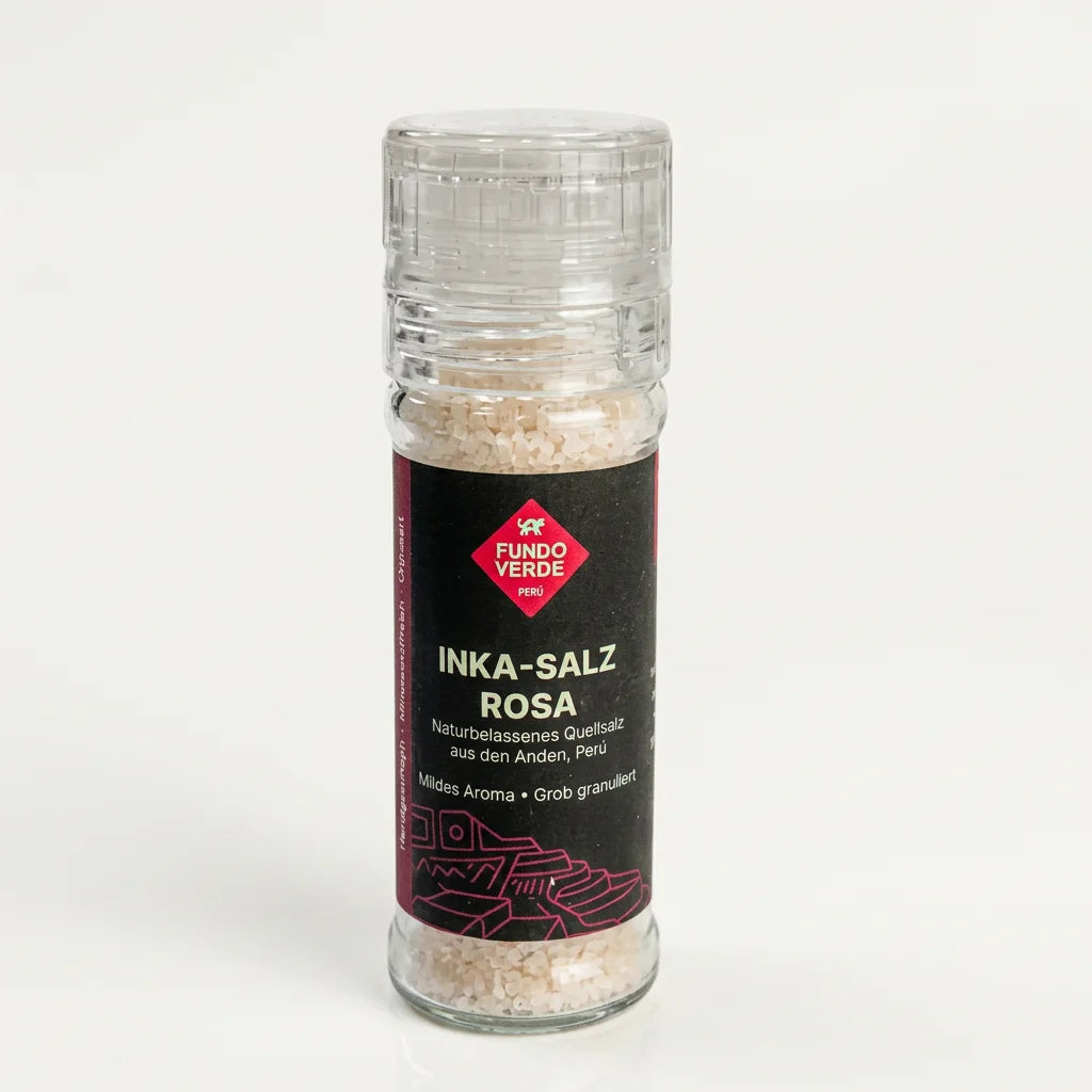 Rosa Inka-Salz aus Maras in einer Glasmühle mit grober Struktur.