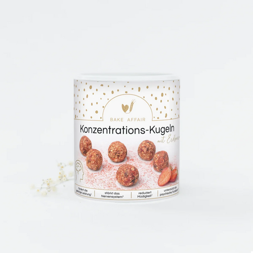 Fruchtige rote Konzentrations-Kugeln mit Erdbeerstückchen in einer nachhaltigen Verpackung.