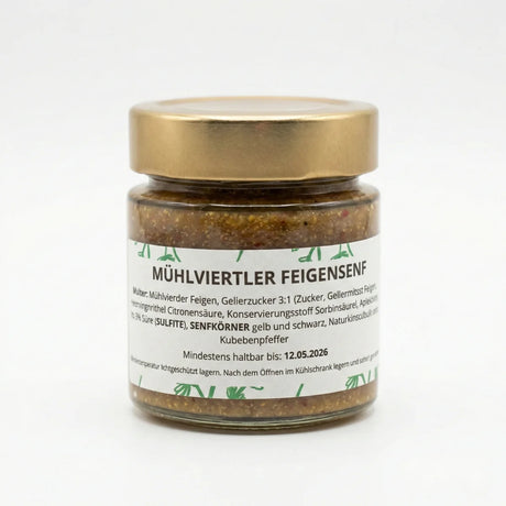 Ein Glas handgemachter Mühlviertler Feigensenf von Romanas Kräuterei auf einem rustikalen Holztisch.