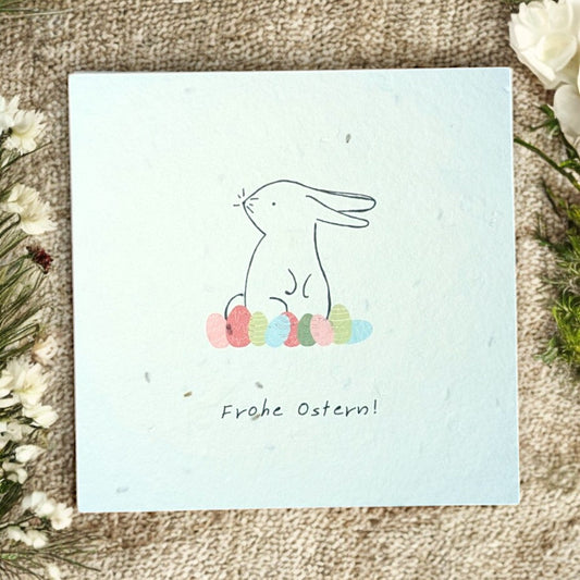 Quadratische Saatpapier-Osterkarte mit Hasenmotiv und „Frohe Ostern“-Aufdruck, 11 x 11 cm, handgemacht in Wien, biologisches Saatgut (Thymian), inklusive Kuvert.